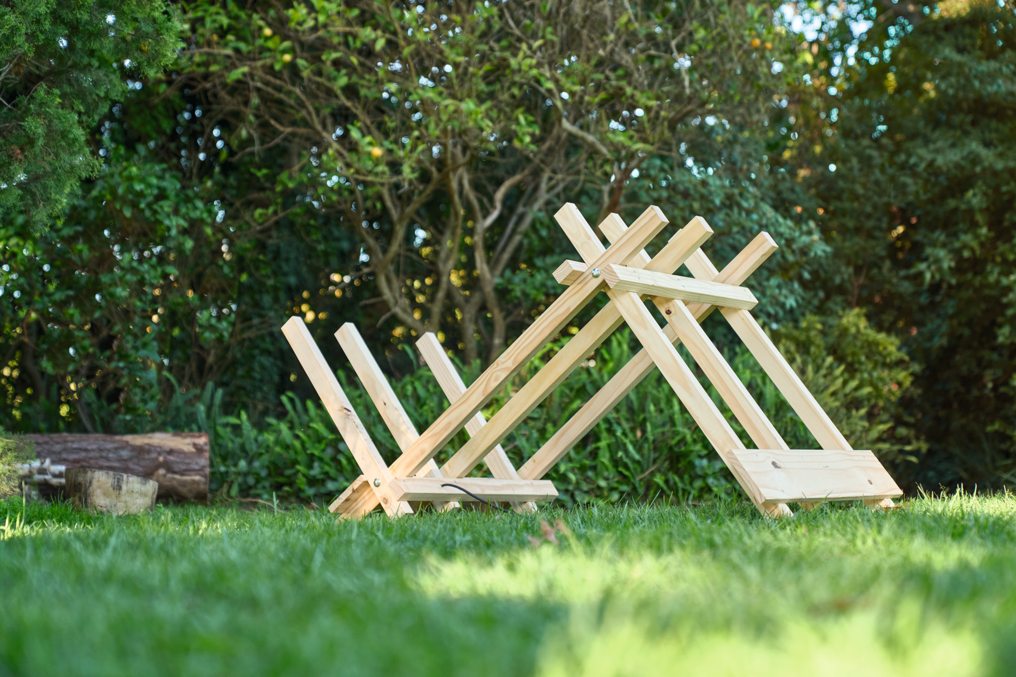 DIY wooden sawhorse in a garden