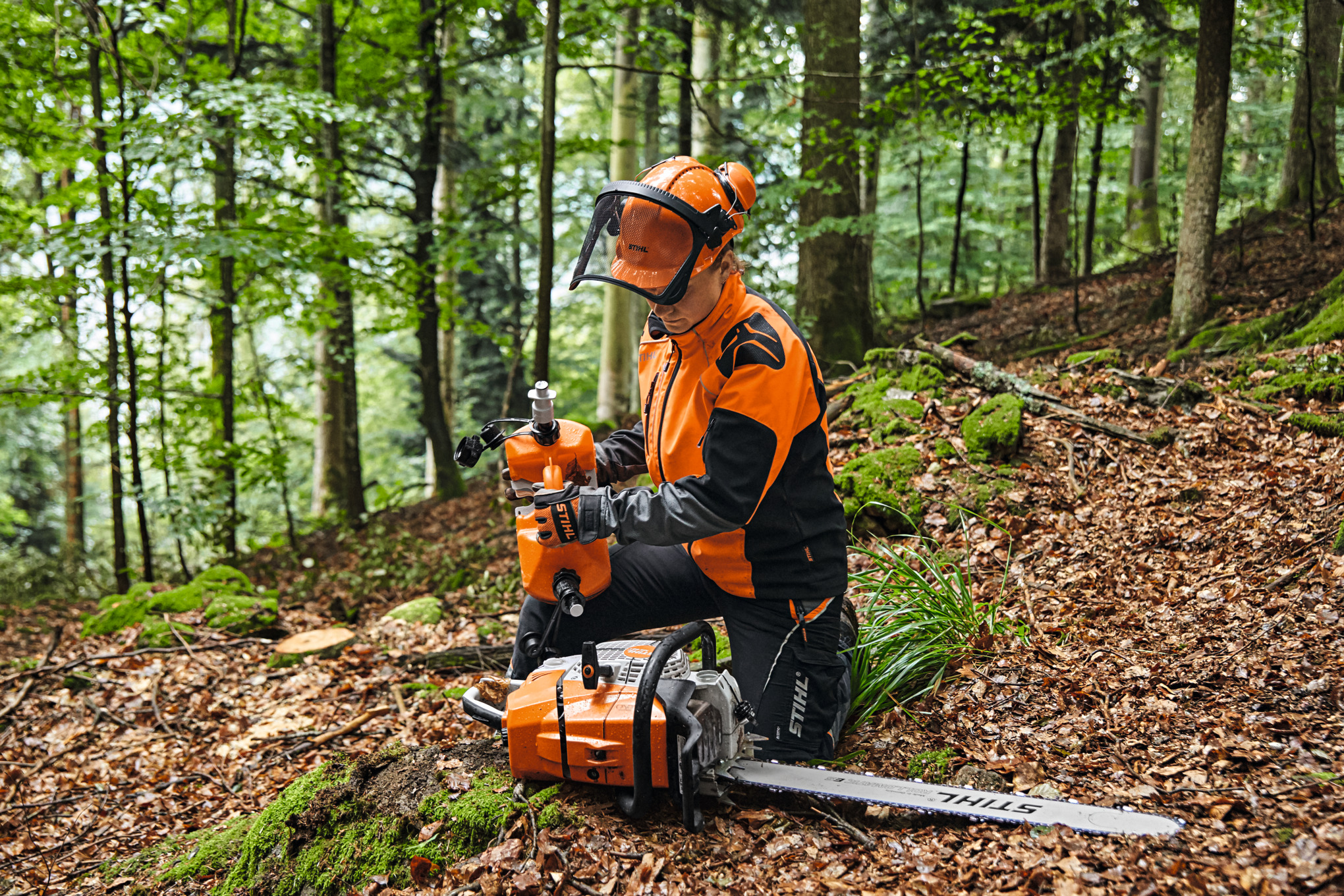  Forester refueling MS 881 in the forest