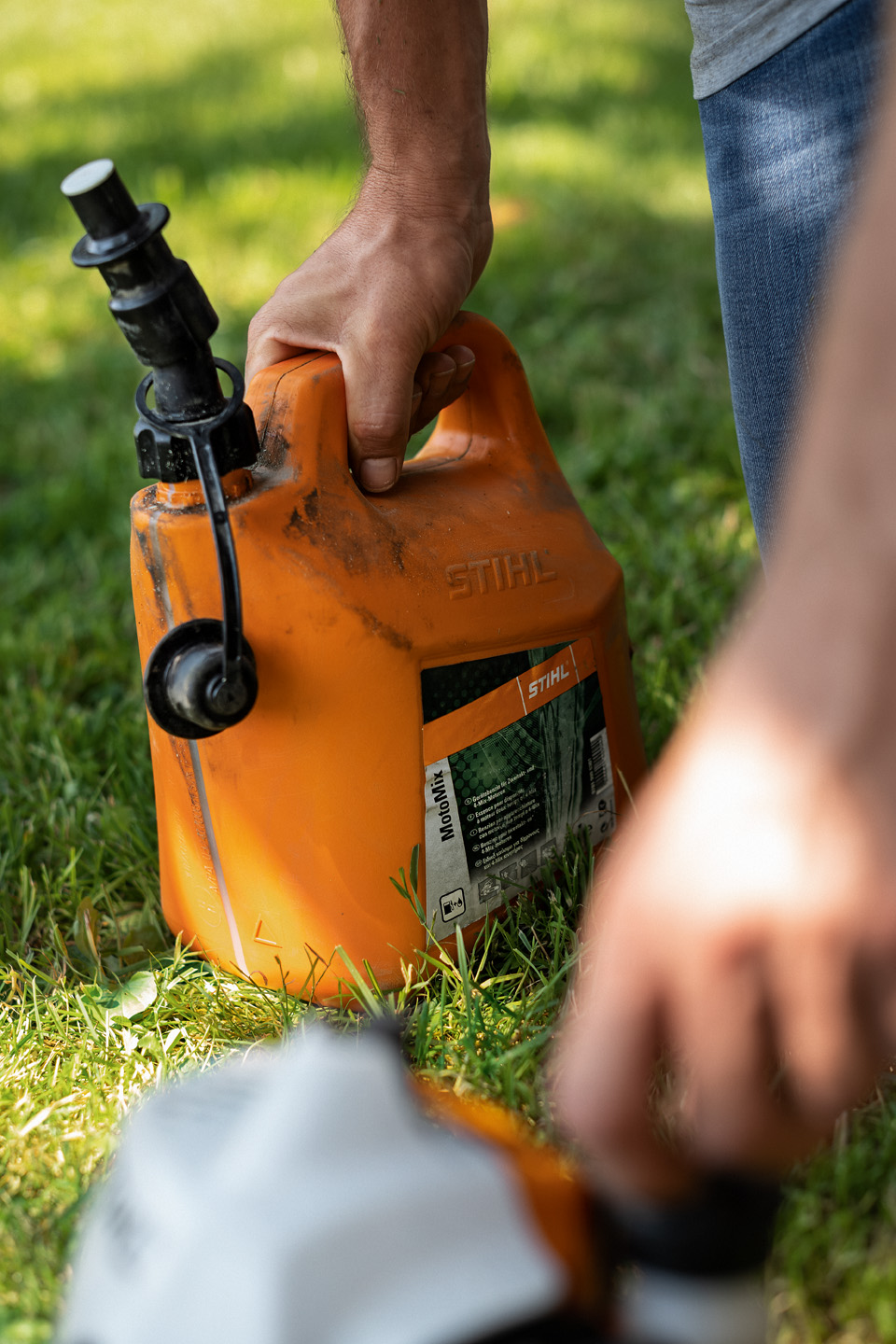 STIHL MotoMix brushcutter fuel in orange canister