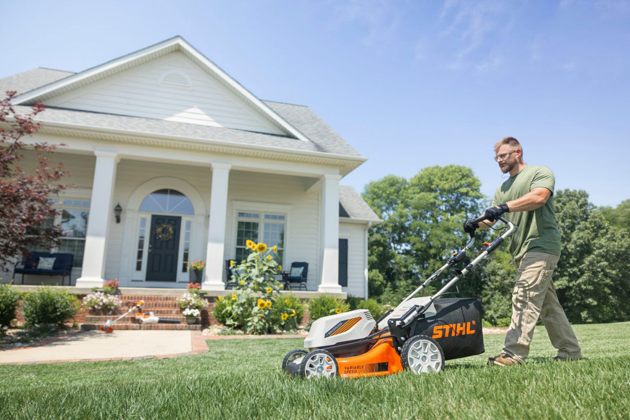 Man mowing lawn with RMA 348 V