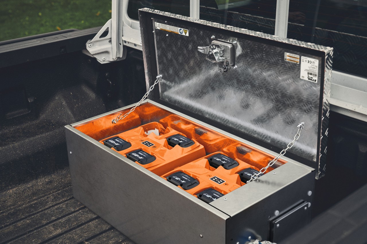 STIHL CB 1 charging station with ALLPRO batteries on pickup loading area